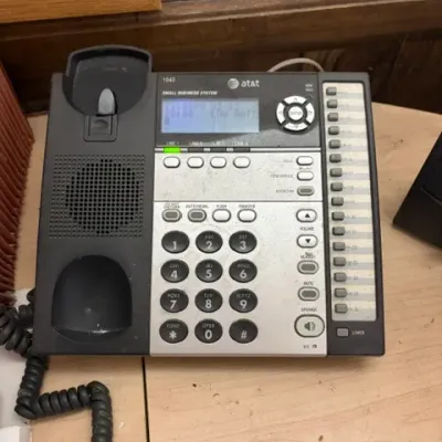 AT&T 1040 4-line small business system landline telephone base with built-in speakerphone and digital display screen.