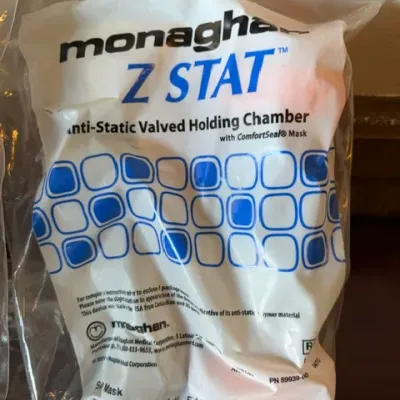 Monaghan Z STAT anti-static valved holding chamber with ComfortSeal mask, sealed in its original plastic packaging.