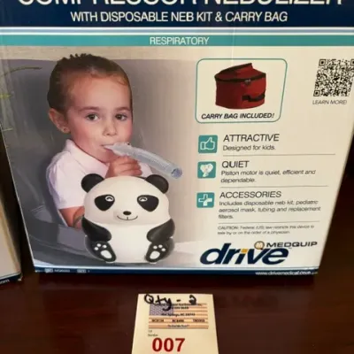 Drive Medical Panda Pediatric Compressor Nebulizer in its original retail packaging, complete with disposable neb kit and carry bag.