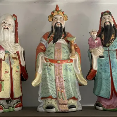 Sale Photo Thumbnail #102: Set of three vintage Chinese porcelain Sanxing (Fu Lu Shou) statues, intricately hand-painted with gold accents and colorful robes.