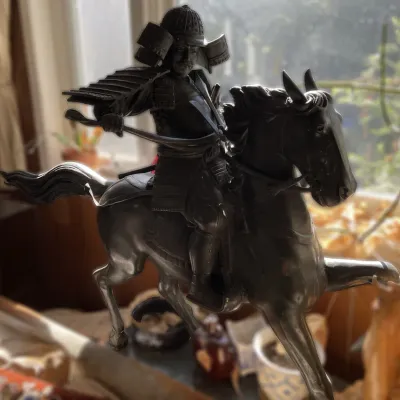 Sale Photo Thumbnail #27: Vintage dark-patinated metal or bronze statue of a Japanese samurai warrior on horseback in full armor.
