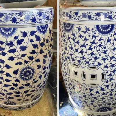 Sale Photo Thumbnail #204: Chinese blue and white porcelain garden stool featuring intricate floral and leafy vine motifs, shown from two angles with pierced double-coin side cutouts.