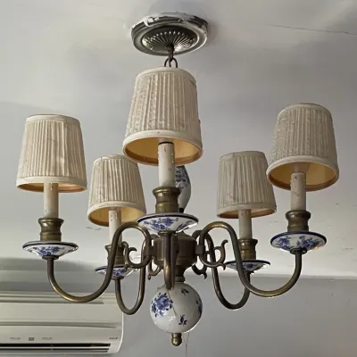 Sale Photo Thumbnail #106: Vintage brass six-light chandelier featuring blue and white floral ceramic details and pleated fabric shades.