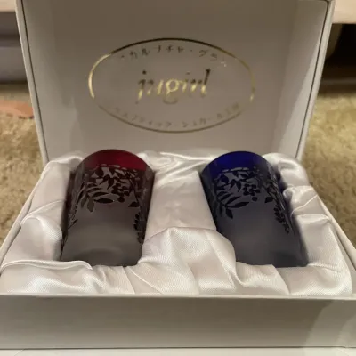 Sale Photo Thumbnail #89: Boxed set of two Japanese etched glass tumblers by Jugirl, featuring red and blue gradient colors with frosted floral patterns inside a satin-lined presentation box.