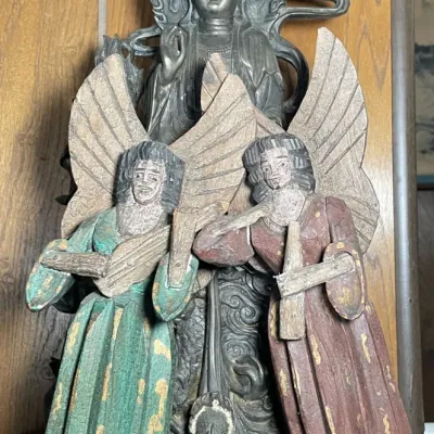 Sale Photo Thumbnail #100: Cast metal Guanyin deity statue sitting behind a pair of carved and painted wooden musical angel figures.