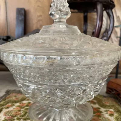 Sale Photo Thumbnail #16: Vintage pressed clear glass covered candy dish featuring a diamond cut pattern and pointed finial handle.