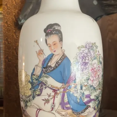 Sale Photo Thumbnail #175: Vintage Chinese porcelain vase featuring a hand-painted scene of a noblewoman framed by floral motifs and detailed blue patterned borders.