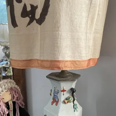Sale Photo Thumbnail #108: Vintage Chinese porcelain hexagonal vase lamp featuring hand-painted figurative scenes, topped with a printed calligraphy fabric shade.