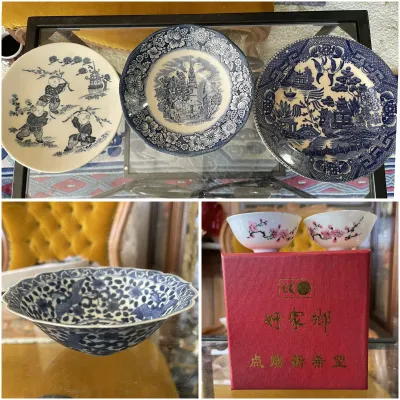Sale Photo Thumbnail #202: Collection of blue and white Asian porcelain items, including three decorative transferware plates, a scalloped bowl with bird motifs, and a boxed pair of small porcelain tea cups.