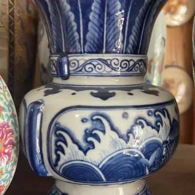 Sale Photo Thumbnail #162: Chinese blue and white porcelain arrow vase featuring wave and plantain leaf motifs.