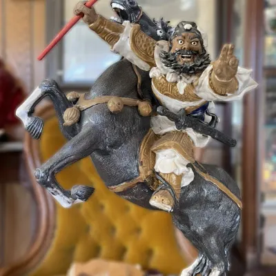 Sale Photo Thumbnail #9: Polychrome Chinese warrior figure depicting Zhang Fei mounted on a rearing black horse, featuring intricate hand-painted armor details and a red spear.