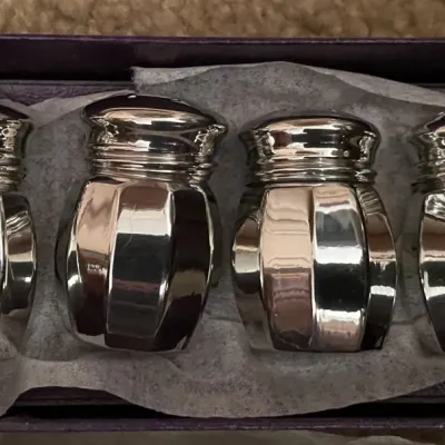 Sale Photo Thumbnail #88: Set of four vintage sterling silver or silver-plated miniature salt and pepper shakers in a fitted presentation box.