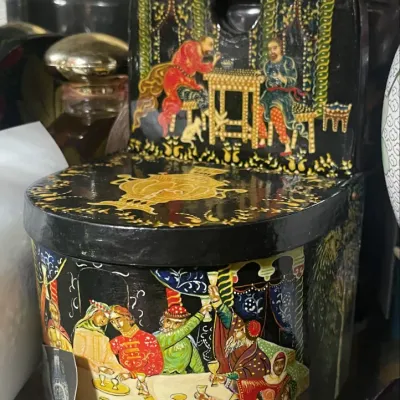 Sale Photo Thumbnail #185: Russian Palekh-style hand-painted lacquer box shaped like a high-backed chair, featuring detailed scenes of figures in traditional attire.