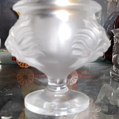 Sale Photo Thumbnail #121: Lalique-style frosted crystal pedestal bowl with molded leaf or feather relief details along the body, displayed inside a glass cabinet.