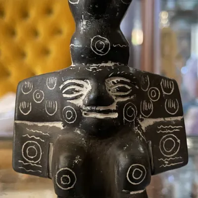 Sale Photo Thumbnail #13: Carved black stone Pre-Columbian style bird figure featuring etched linear and circular details filled with white pigment.