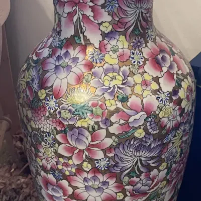 Sale Photo Thumbnail #152: Vintage Chinese Millefleurs porcelain vase featuring dense hand-painted floral motifs and gilded accents.