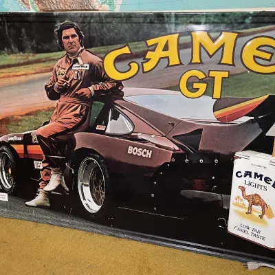 Sale Photo Thumbnail #45: Vintage Camel GT racing advertising sign featuring IMSA race car driver Al Holbert, circa 1980s.