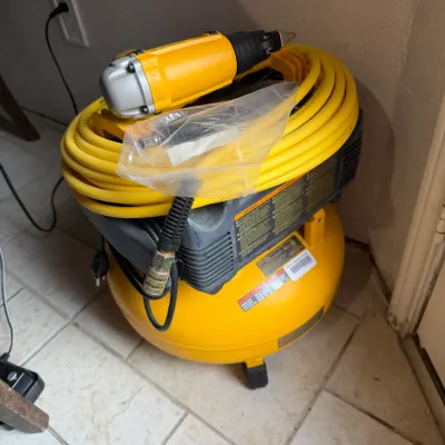 Sale Photo Thumbnail #381: Yellow pancake air compressor set with wrapped hose