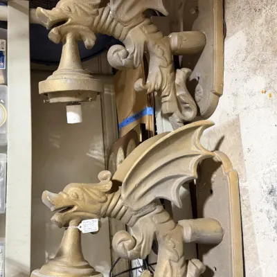 Sale Photo Thumbnail #335: Pair of vintage dragon-shaped wall sconces painted in gold, featuring detailed winged gargoyle figures, including a boxed pair of new shades