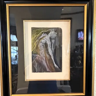 Sale Photo Thumbnail #177: Framed Salvador Dalí print, housed in a thick black frame with gold accents.