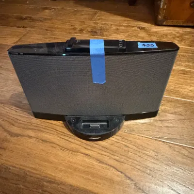 Sale Photo Thumbnail #126: Bose SoundDock digital music system speaker in black, featuring an integrated 30-pin iPod dock and attached remote control.