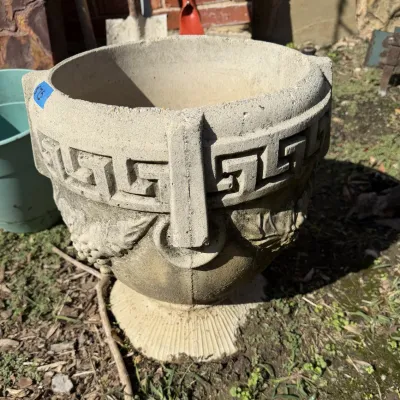 Sale Photo Thumbnail #405: Heavy concrete garden planter featuring Greek key border detailing and grape cluster relief motifs.
