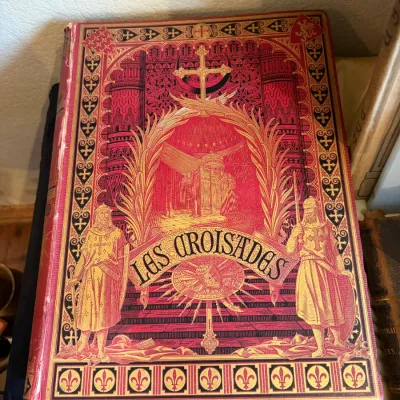 Sale Photo Thumbnail #67: Antique French edition of "Les Croisades" featuring a heavily decorated, gilt and polychrome pictorial cloth cover depicting medieval crusaders. set of 2
