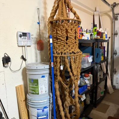 Sale Photo Thumbnail #339: Vintage 1970s boho macramé hanging swag lamp fixture accented with wooden beads.