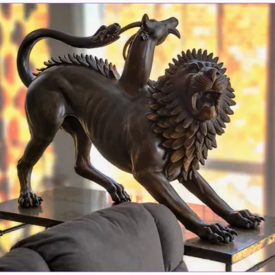 Sale Photo Thumbnail #185: Bronze sculpture depicting the Chimera of Arezzo, featuring intricate details of the lion's body, goat neck, and serpent tail. (Full-size)