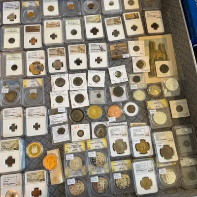 Sale Photo Thumbnail #60: Extensive collection of graded and flip-mounted ancient, world, and commemorative coins displayed 