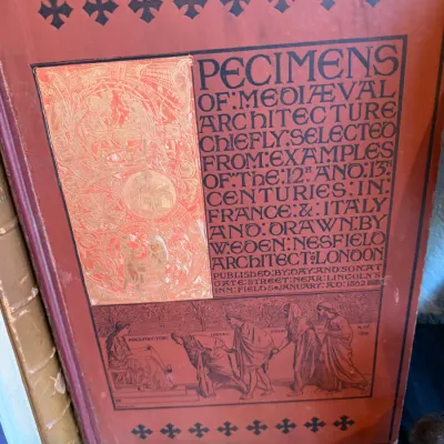 Sale Photo Thumbnail #79: Antique 1862 book edition of "Specimens of Mediaeval Architecture" by W. Eden Nesfield, featuring an ornate red cloth binding with black and gilt illustrations.