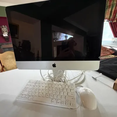Sale Photo Thumbnail #294: Apple iMac desktop computer in aluminum enclosure, complete with a white Macally keyboard and USB mouse.