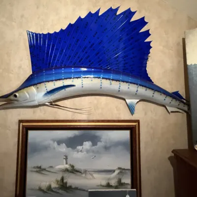 Sale Photo Thumbnail #230: Large taxidermy sailfish wall mount featuring vibrant blue paint and detailed fin work.