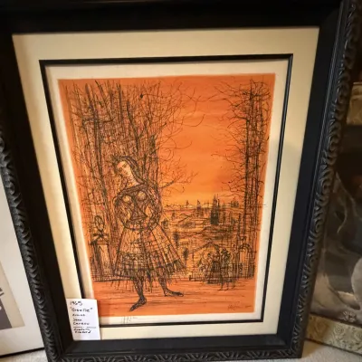Sale Photo Thumbnail #218: Framed 1965 lithograph titled 'Giselle' by Jean Carzou, featuring a stylized figure against an orange background in an ornate black frame.