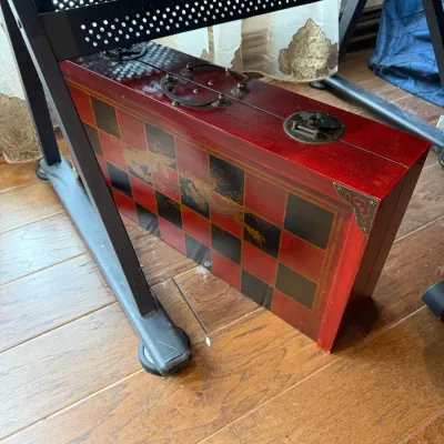 Sale Photo Thumbnail #135: Vintage Asian-style folding wooden game board case, featuring a red and black checkered exterior with painted dragon accents and ornate brass hardware.