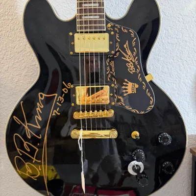 Sale Photo Thumbnail #92: Autographed Gibson B.B. King Lucille electric guitar in black finish with gold hardware, signed and dated 7-13-06 in gold marker.