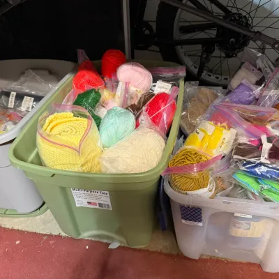 Sale Photo Thumbnail #345: Large collection of assorted knitting yarn skeins and craft supplies stored in plastic storage totes.