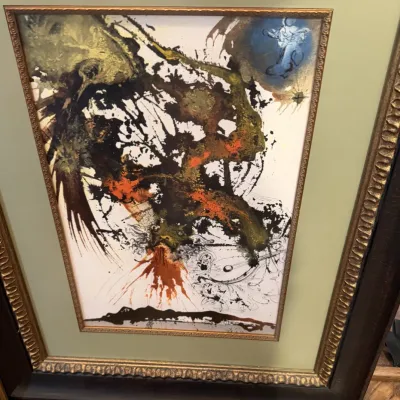Sale Photo Thumbnail #205: Framed surrealist art print by Salvador Dalí, housed in an ornate gilded wood frame with a sage green mat.